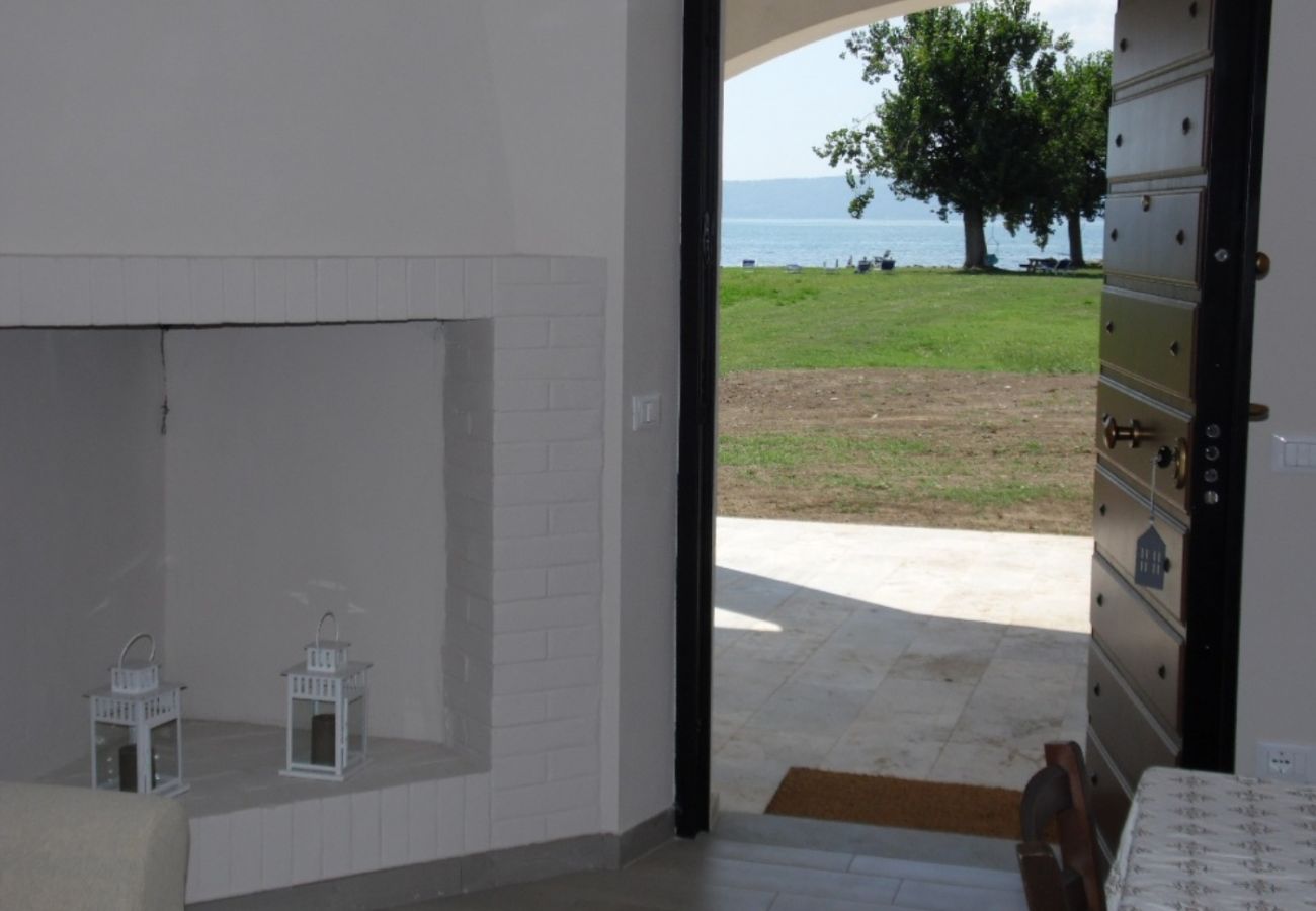 kitchen with fireplace in the holiday apartment Artume in Bolsena