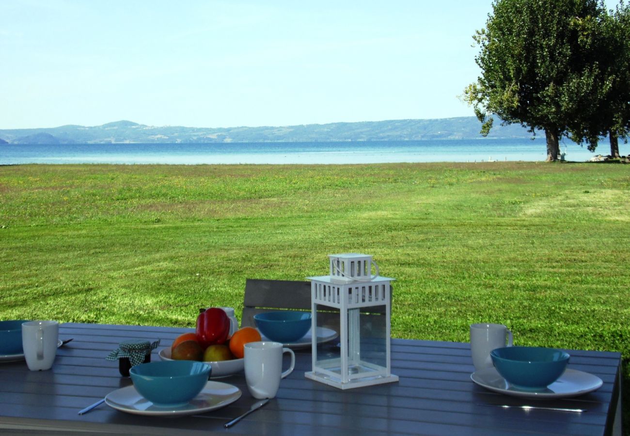 garden with lake view  in the holiday apartment Artume in Bolsena