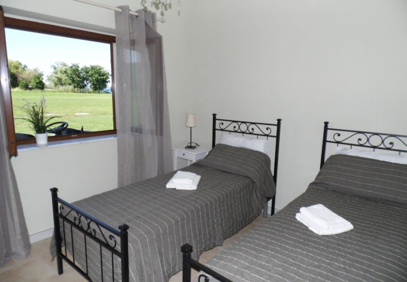 bedroom with twin beds in the holiday house on Lake Bolsena 