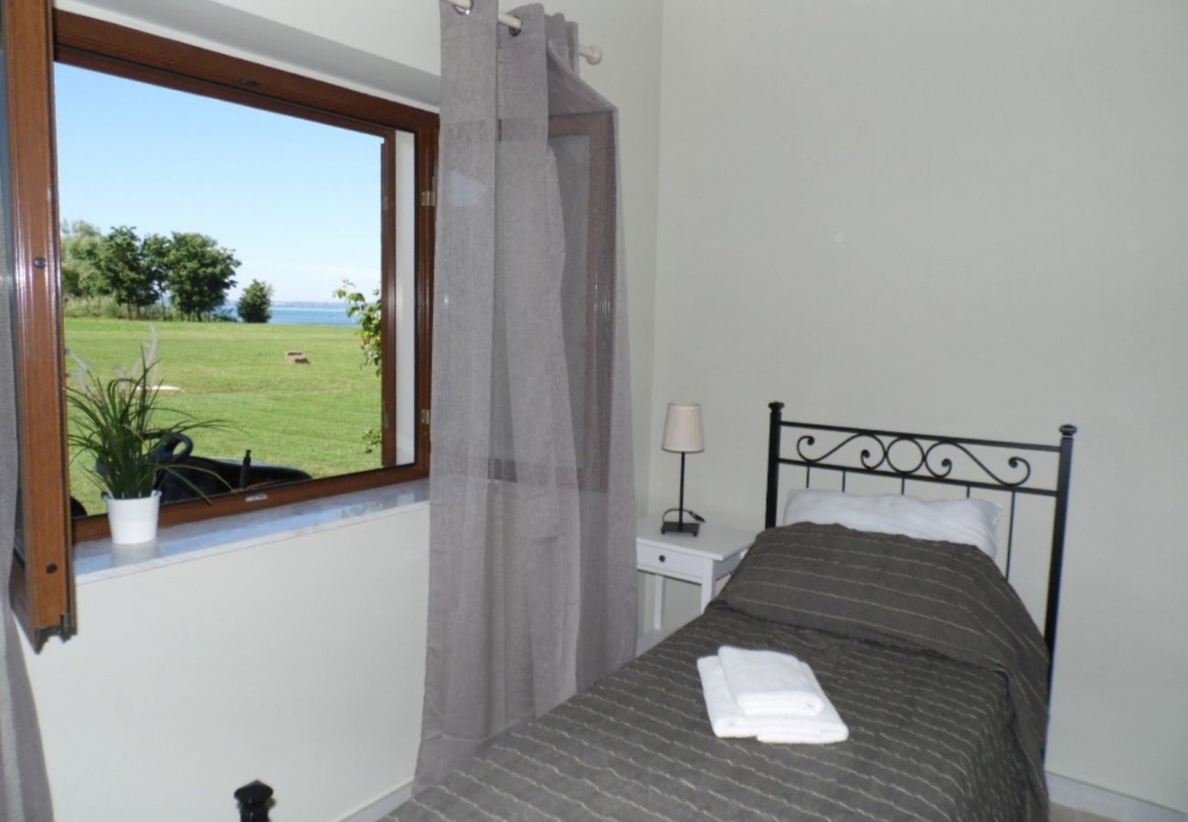 bedroom with twin beds in the holiday house on Lake Bolsena