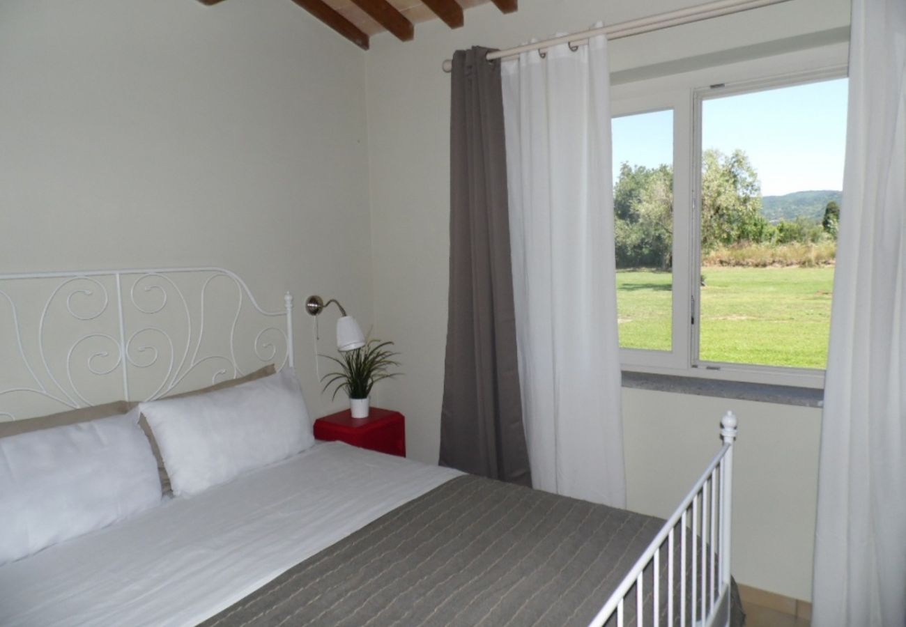 bedroom with view of the garden in Bolsena