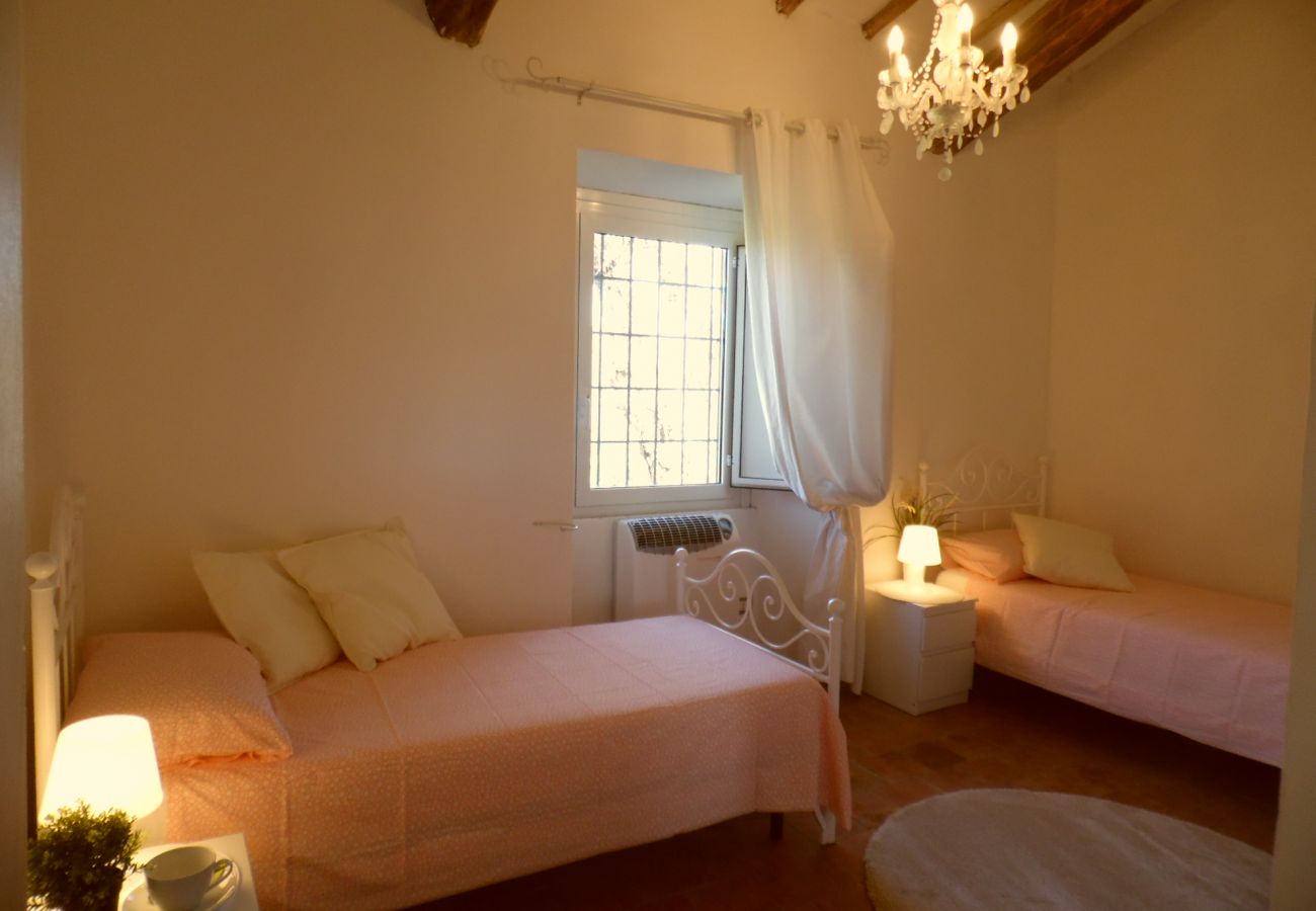 bedroom with twin beds by Lake Bolsena